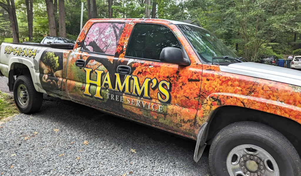 Hamm's Tree Service branded work truck with phone number 919-641-3064